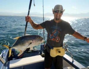 Nathan holding a fish he caught in Puerto Vallarta