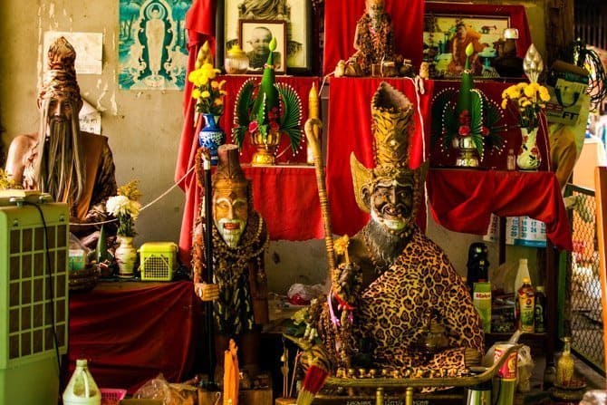 Statues in the Sak Yant bamboo tattoo parlor and shrine