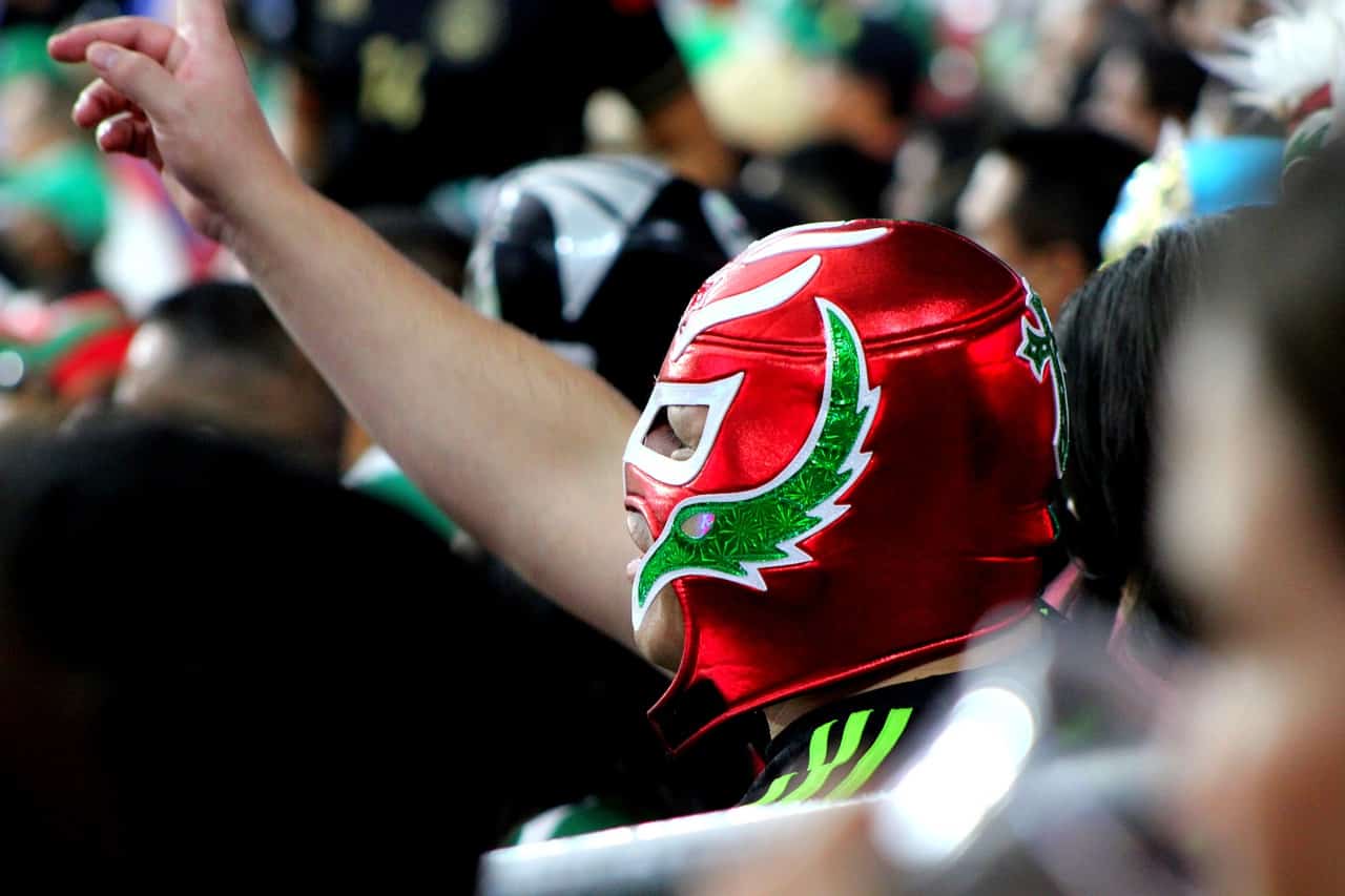Man wearing a colorful Mexican wrestling mask