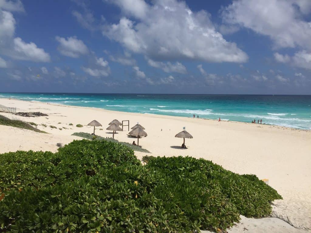 Playa Delfines Beach with thatch huts