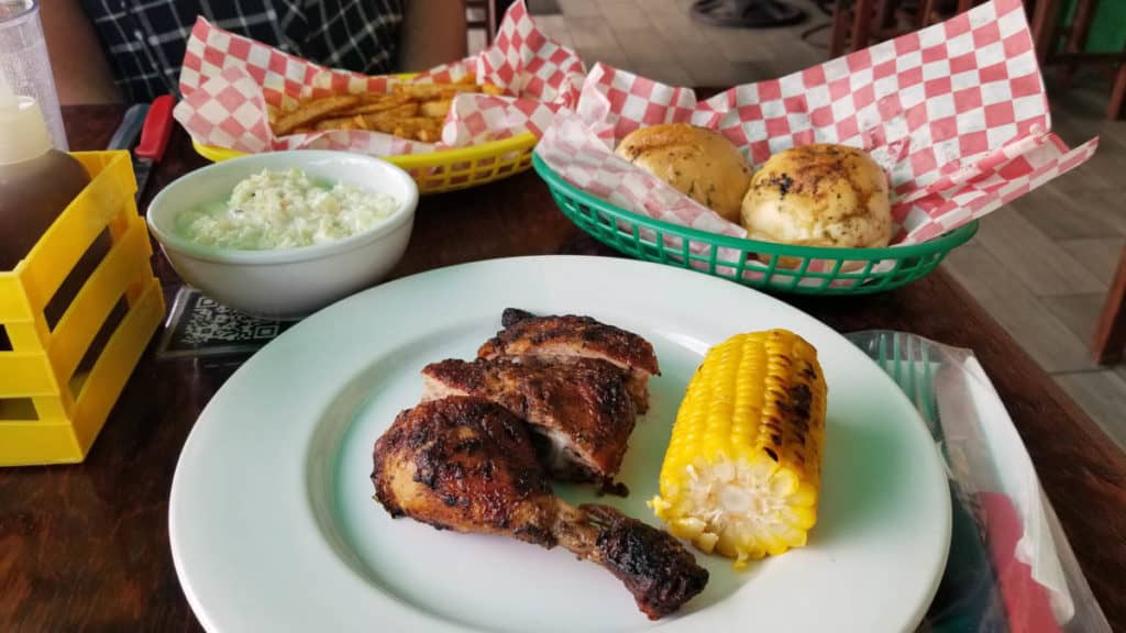 Jerk chicken with coleslaw and fries