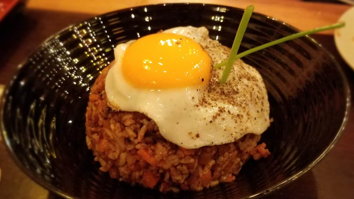 Bowl of fried rice with a fried egg on top