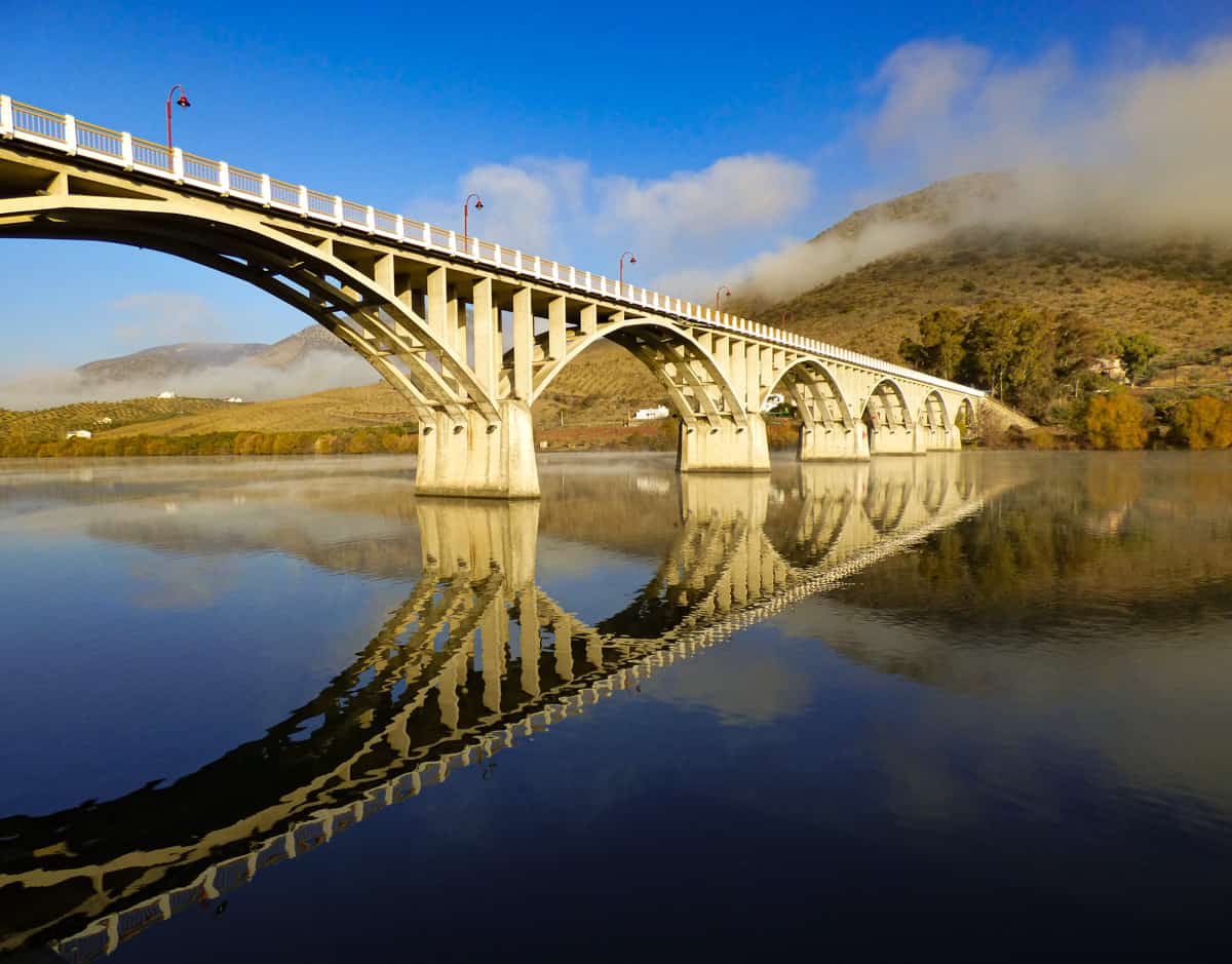 Arched bridge reflection on water