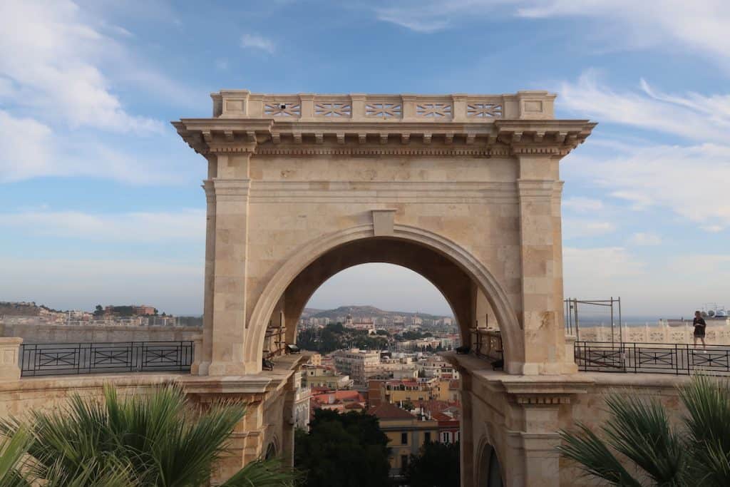 Stone archway with city behind