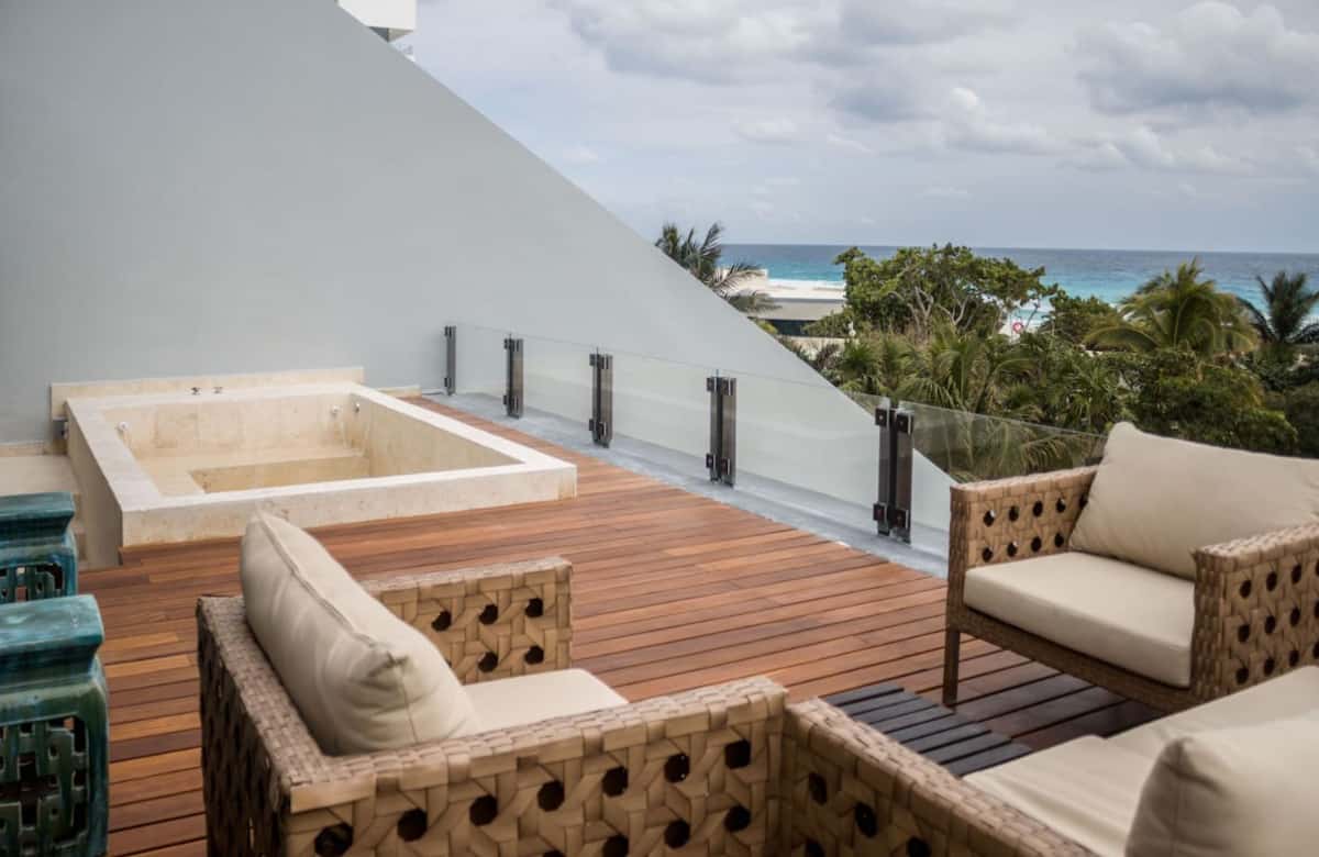 Hot tub on the deck with an ocean view at Cancun Airbnb