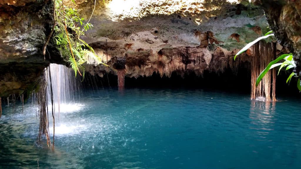 Blue water in a cave cenote