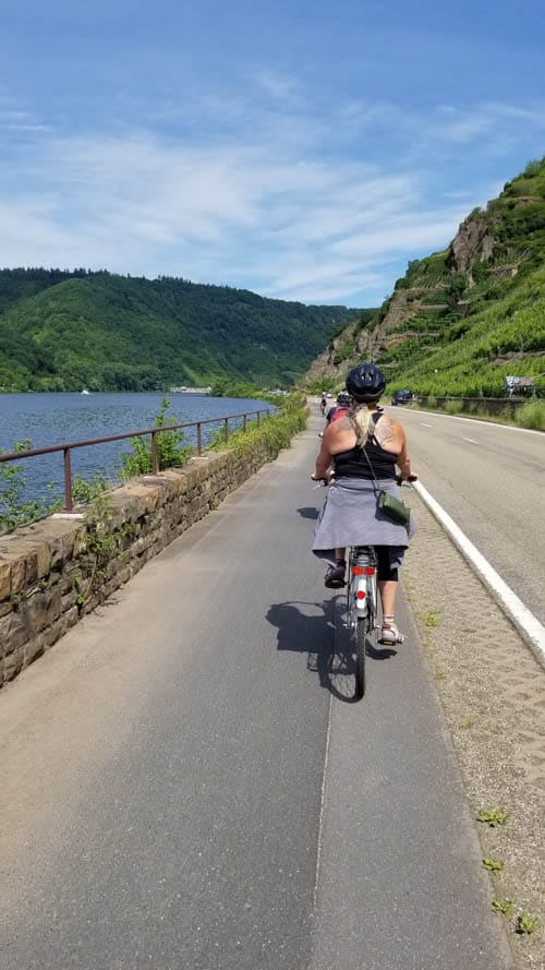 Enjoying the scenery from bikes on our Emerald River Cruise