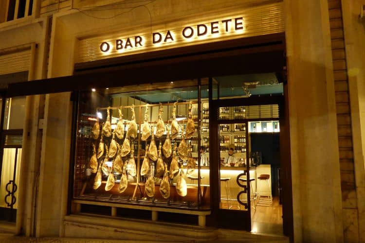 Ham hocks hanging in a window in Lisbon